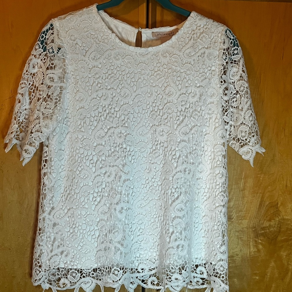 White eyelet laced blouse.